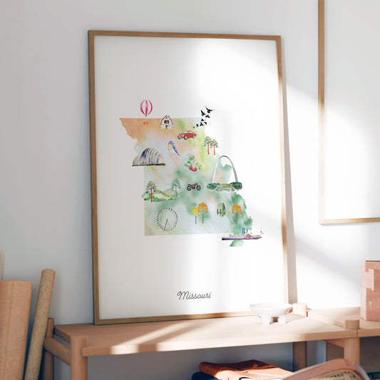 a framed watercolor painting of a map of Missouri, with various landmarks and symbols depicted.