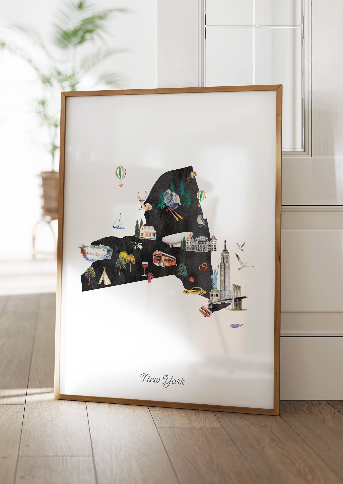 A framed collage of various New York-themed illustrations, including landmarks, buildings, and people, is displayed on a wooden floor.