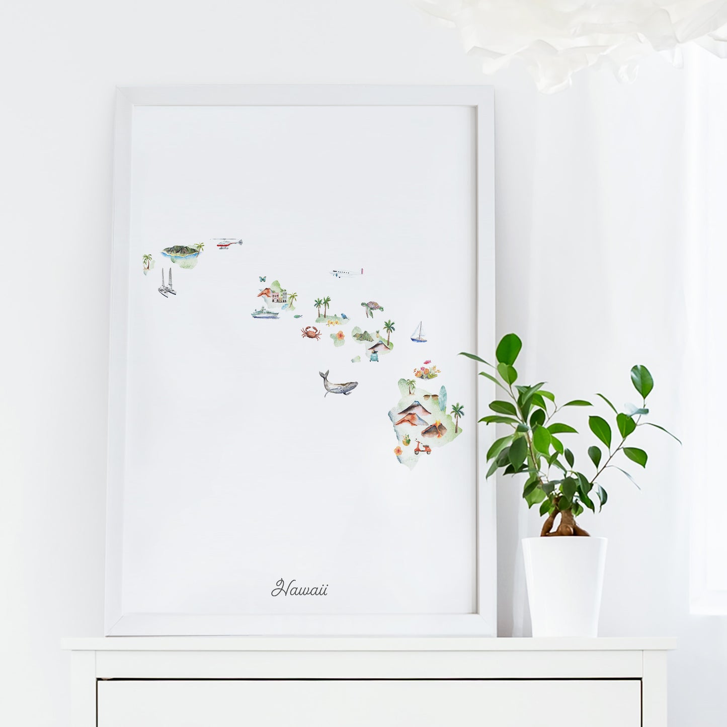 a framed watercolor painting of Hawaii, with various tropical elements such as palm trees, birds, and other wildlife. The painting is displayed on a white shelf, and there is a potted plant next to it.