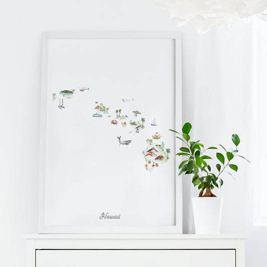 a framed watercolor painting of Hawaii, with various tropical elements such as palm trees, birds, and other wildlife. The painting is displayed on a white shelf, and there is a potted plant next to it.