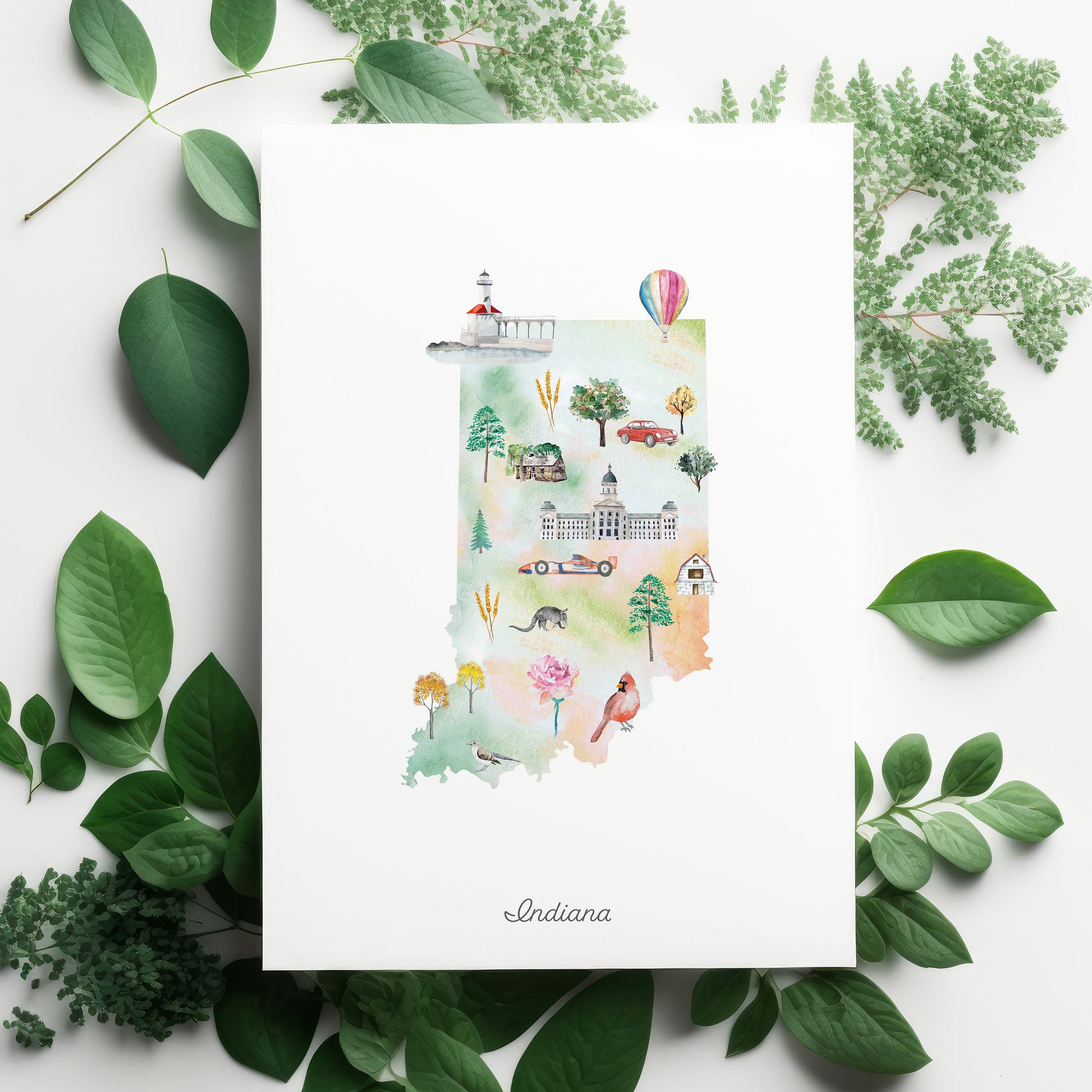 The image is a watercolor illustration of the state of Indiana, surrounded by green leaves and flowers.
