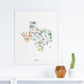 a framed watercolor map of Texas, with various illustrations and landmarks depicted on it.