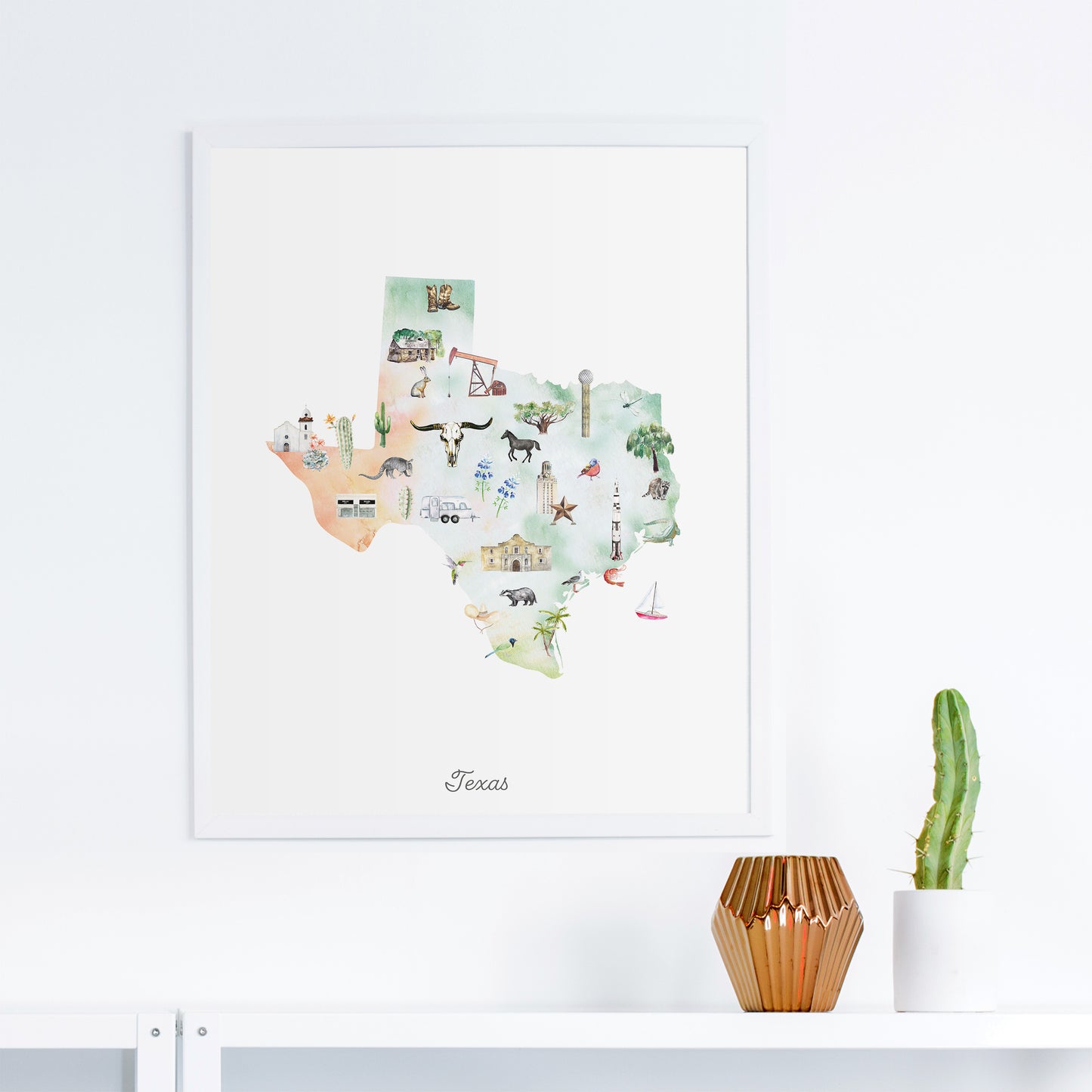 a framed watercolor map of Texas, with various illustrations and landmarks depicted on it.