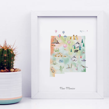 a framed watercolor illustration of New Mexico, with various landmarks and symbols such as mountains, cacti, and hot air balloons.