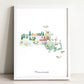 The image is a framed watercolor illustration depicting various landmarks and scenes from Massachusetts, including a castle, a lighthouse, a bird, and a deer.