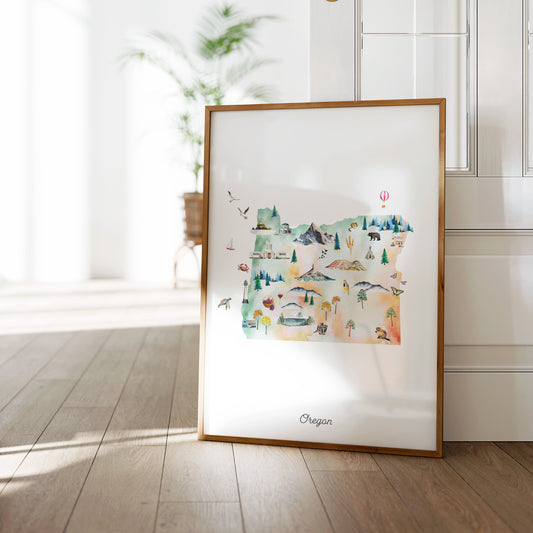 a framed watercolor painting of the state of Oregon, with various landscapes and landmarks depicted in a colorful and artistic style.