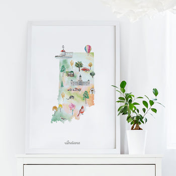 a framed watercolor illustration of the state of Indiana, with various landmarks and symbols representing the state's unique characteristics.