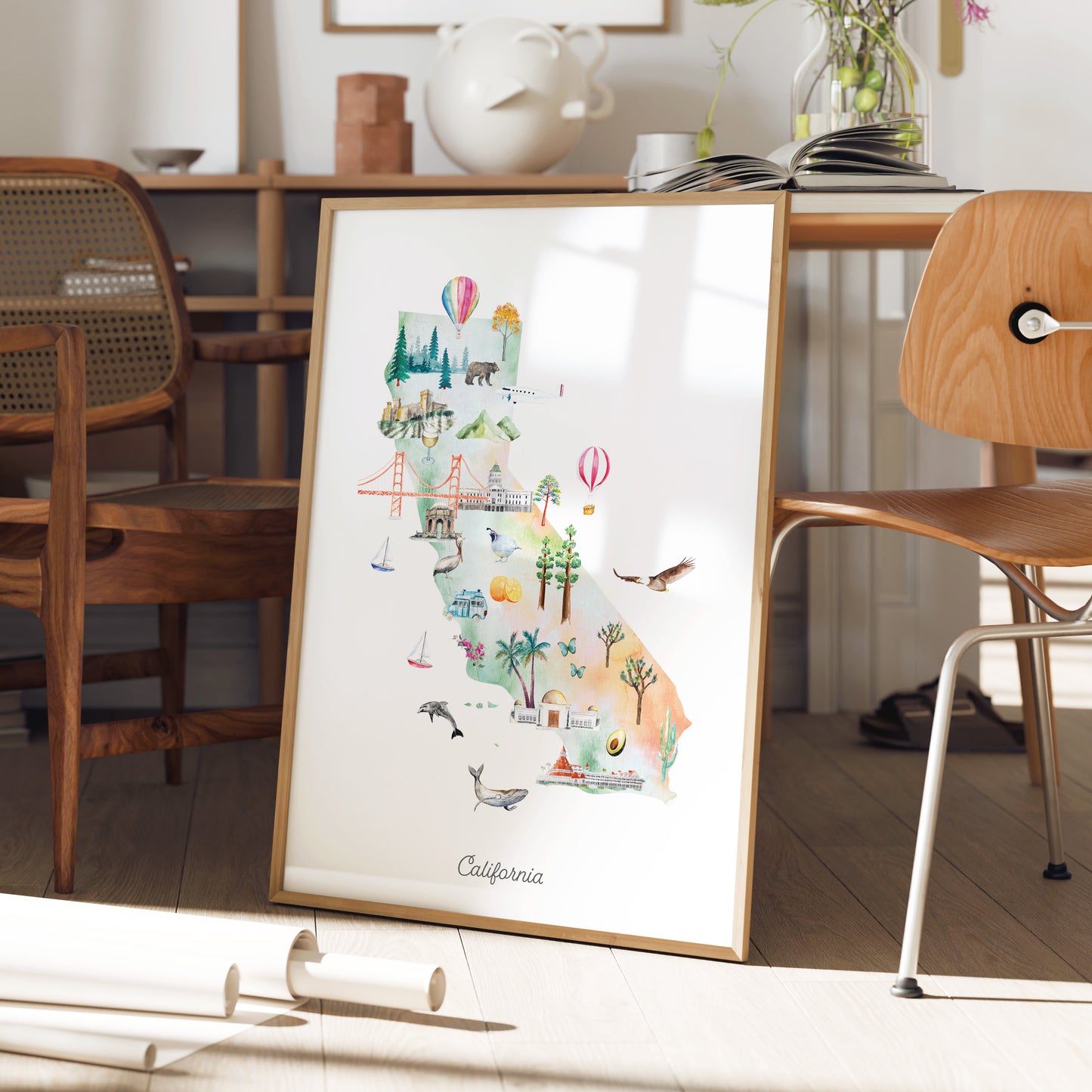 a framed illustration of California, showcasing various landmarks and scenes from the state.